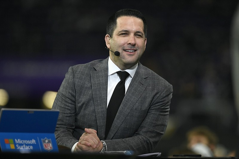 FILE - ESPN Monday Night Countdown personality Adam Schefter on the set before an NFL football game between the Minnesota Vikings and the Green Bay Packers, Monday, Dec. 23, 2019, in Minneapolis. (AP Photo/Craig Lassig)



