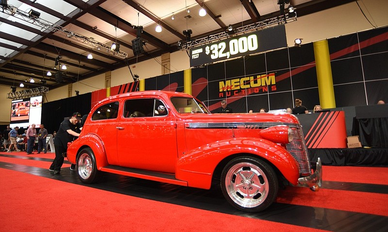 Staff Photo by Matt Hamilton / A 1937 Pontiac Slantback rolls off the auction block after being sold at the Chattanooga Convention Center in downtown Chattanooga on Friday, October 15, 2021 during the Chattanooga Motorcar Festival.