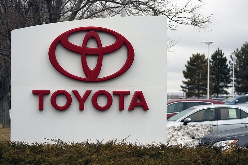 FILE - In this Sunday, March 21, 2021 file photo, the company logo adorns a sign outside a Toyota dealership in Lakewood, Colo. Nippon Steel Corp. is suing Toyota Motor Corp. over a patent for technology key for electric motors in a rare case of legal wrangling between Japan’s top steelmaker and automaker over intellectual property. Tokyo-based Nippon Steel filed the lawsuit Thursday, Oct. 14, in Tokyo District Court, demanding compensation for damages totaling 20 billion yen ($177 million). Also named in the lawsuit is Baoshan Iron & Steel Co., or Baosteel, a Chinese steelmaker that produces and supplies the steel that allegedly violates the patent.  (AP Photo/David Zalubowski, File)