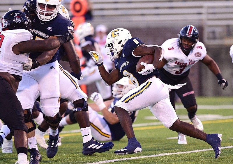 Staff photo by Robin Rudd / UTC running back Gino Appleberry finds a hole in Austin Peay's defense during a nonconference game on Sept. 2 at Finley Stadium. After losing that night, UTC bounced back to post a shutout at North Alabama, but through five games this season the Mocs have yet to win consecutive contests while struggling with inconsistency from week to week.