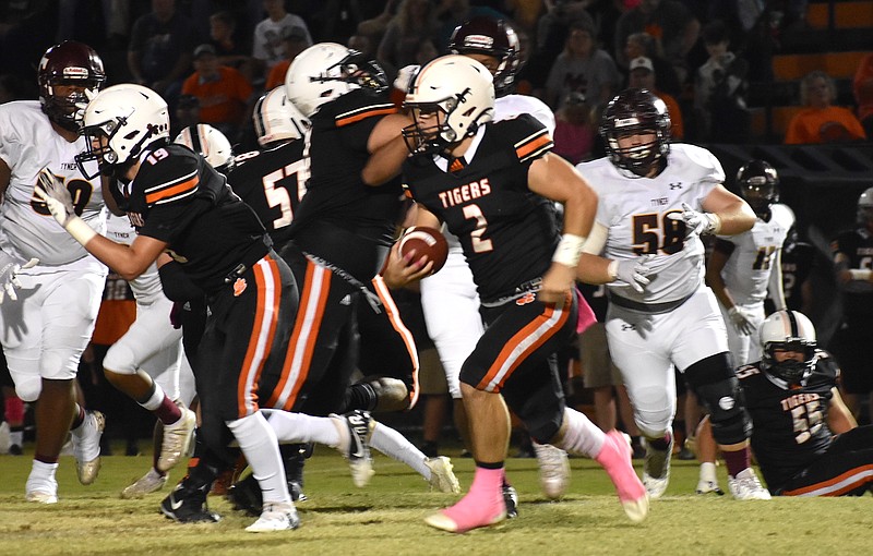 Staff photo by Patrick MacCoon / Meigs County senior quarterback Logan Carroll rushed for two scores and had an interception to help lead a senior night comeback win over visiting Tyner on Friday in Decatur, Tenn.