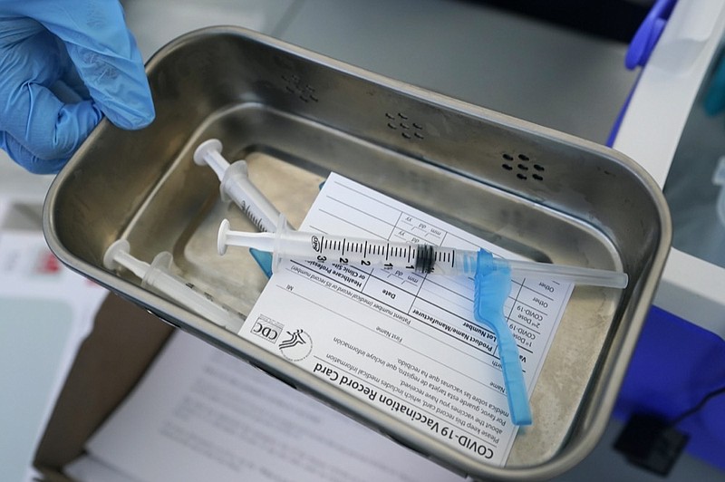 FILE - This May 13, 2021, file photo shows syringes filled with the Johnson & Johnson vaccine at a mobile vaccination site in Miami. (AP Photo/Wilfredo Lee, File)



