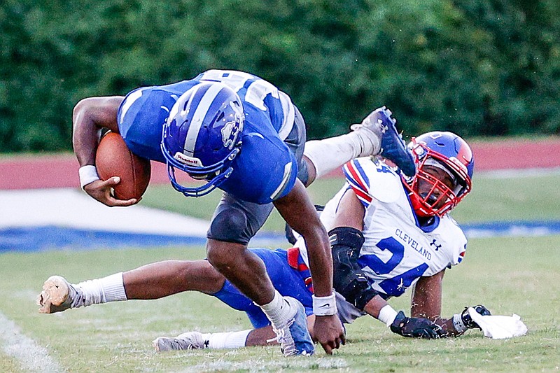 Staff photo by Troy Stolt / Red Bank quarterback Joseph Blackmon, with ball, scrambles on a broken play during an Aug. 20 home game against Cleveland. On Friday night, Blackmon helped lead the Lions to a lopsided win against Fayetteville.