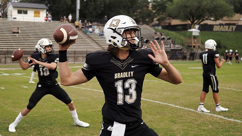 Staff photo / Bradley Central's Aiden McClary (13) warms up before a home game in September 2020. Bradley Central beat Farragut on Friday night.