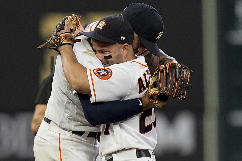 AP photo by David J. Phillip / Houston Astros shortstop Carlos Correa, left, celebrates with Jose Altuve after Friday night's home win against the Boston Red Sox to open the AL Championship Series.