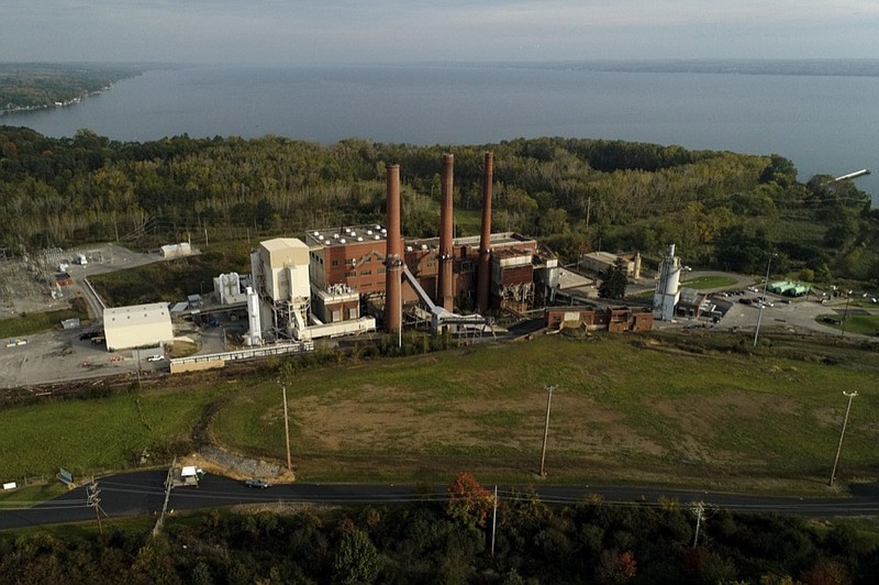 A brief patch of early morning sunlight brightens the landscape around the Greenridge Generation power plant on the banks of Seneca Lake, Friday, Oct. 15, 2021, in Dresden, N.Y. (AP Photo/Julie Jacobson)


