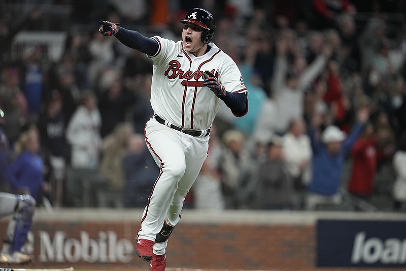 AP photo by Ashley Landis / The Atlanta Braves' Austin Riley celebrates after hitting the winning RBI single in the bottom of the ninth inning in Game 1 of the NL Championship Series against the visiting Los Angeles Dodgers on Saturday night. Ozzie Albies scored on the play.