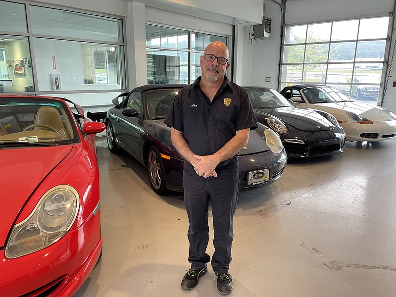 Staff photo by Mark Kennedy. Mike Schatz, 57, is a master technician at Porsche of Chattanooga. He and his family moved here from Southern California.