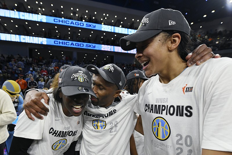 AP photo by Paul Beaty / Chicago Sky coach James Wade, center, celebrates with Candace Parker, right, and Kahleah Copper after the team beat the Phoenix Mercury in Game 4 of the WNBA Finals on Sunday to wrap up the best-of-five series and the title at home.