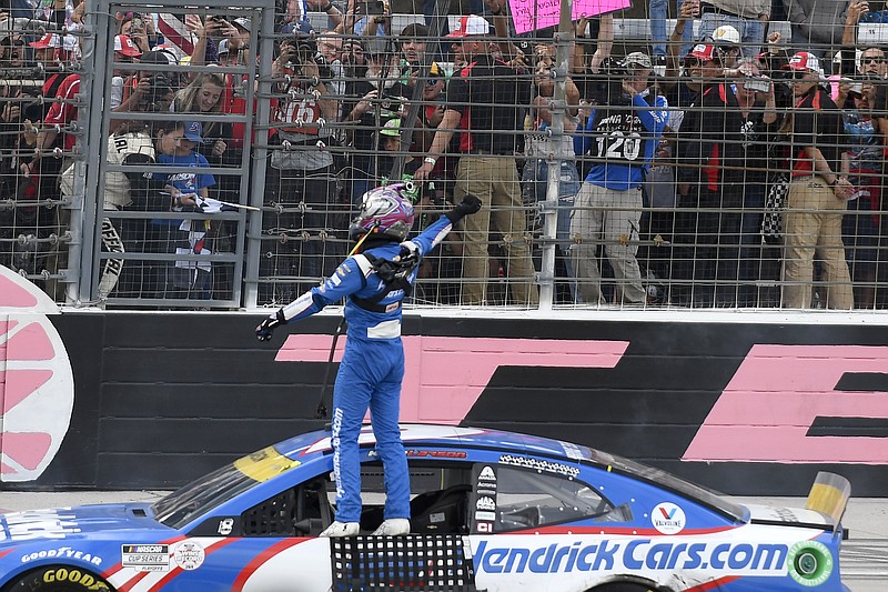 AP photo by Randy Holt / Kyle Larson celebrates after winning Sunday's NASCAR Cup Series playoff race at Texas Motor Speedway in Fort Worth.