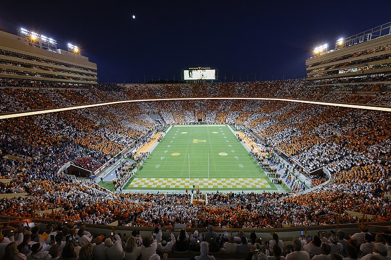 AP photo by Wade Payne / Tennessee fans dressed in orange and white to form a checkerboard pattern in a sold-out Neyland Stadium for Saturday night's football game against Ole Miss.