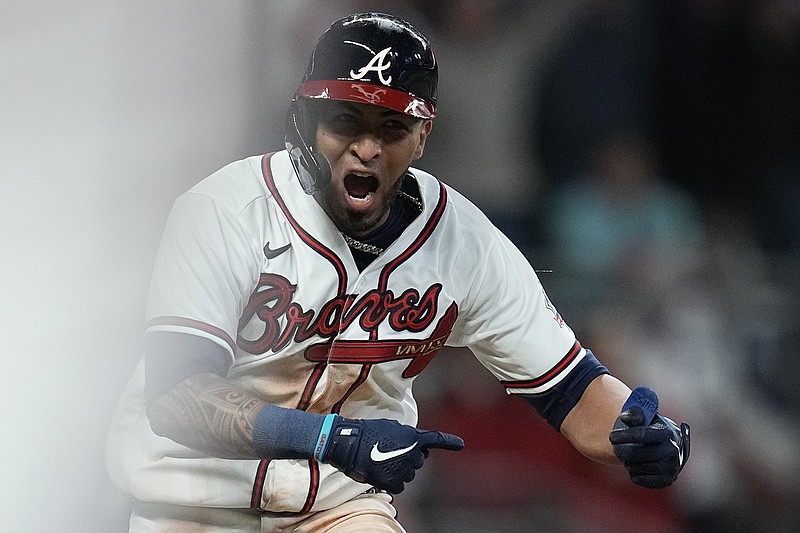 AP photo by Ashley Landis / The Atlanta Braves' Eddie Rosario celebrates after hitting an RBI single in the bottom of the ninth inning to lift his team to a 5-4 win against the visiting Los Angeles Dodgers on Sunday night and a 2-0 lead in the best-of-seven NL Championship Series.