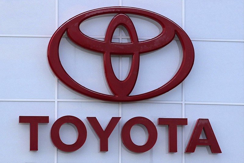 FILE - The Toyota logo is shown on a dealership in Manchester, N.H., in this Thursday, Aug. 15, 2019, file photo. Toyota plans to build a new $1.29 billion factory in the U.S. to manufacture batteries for gas-electric hybrid and fully electric vehicles. The plant location wasn't announced, but the company said it eventually will employ 1,750 people and start making batteries in 2025, gradually expanding through 2031. (AP Photo/Charles Krupa, File)