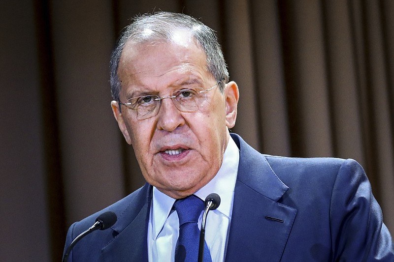 In this handout photo released by the Russian Foreign Ministry Press Service, Russian Foreign Minister Sergey Lavrov speaks on the side of the meeting dedicated to the 25th anniversary of the House of Russian Diaspora named after Alexander Solzhenitsyn in Moscow, Russia, Monday, Oct. 18, 2021. Russia's foreign minister says that the country is suspending its mission to NATO. Lavrov said Monday that the move is in response to last week's expulsion by NATO of eight members of Russia's mission to the military alliance. NATO said that they were secretly working as intelligence officers and halved the size of Moscow's team able to work at its headquarters. Lavrov also announced that NATO's military liaison and information offices in Moscow would be closed.(Russian Foreign Ministry Press Service via AP)