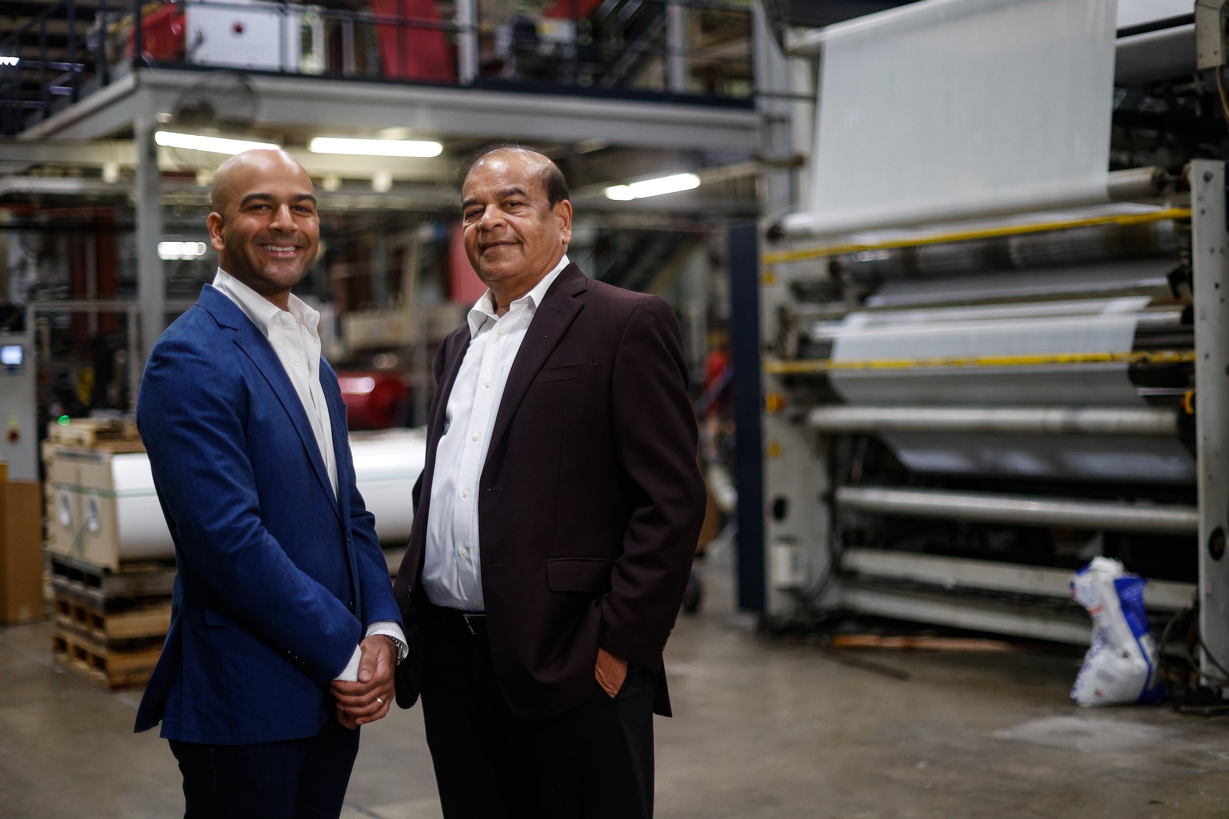 Photography by Troy Stolt / Harshad Shah, owner of Hamilton Plastics, with his son Guru.