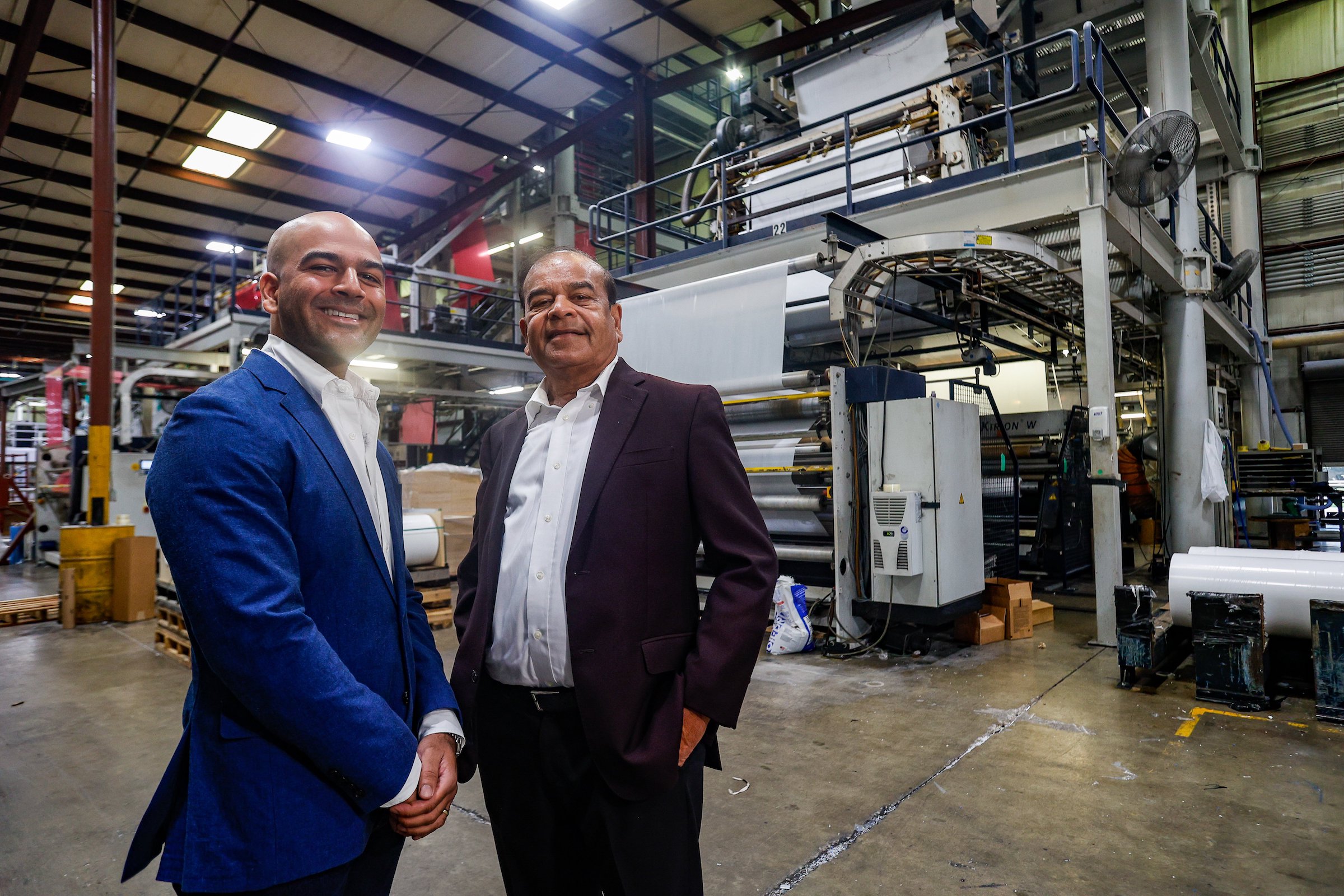 Photography by Troy Stolt / Harshad Shah, owner of Hamilton Plastics, with his son Guru.