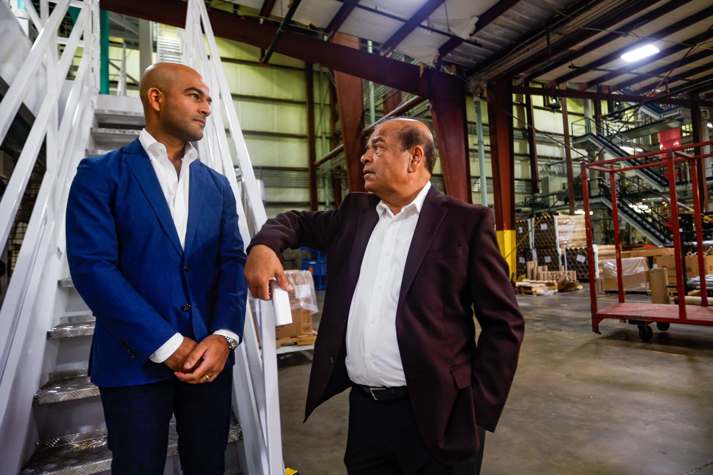 Photography by Troy Stolt / Harshad Shah, owner of Hamilton Plastics, with his son Guru.