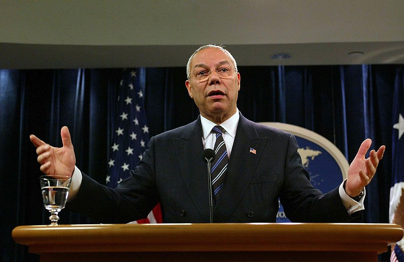 Photo by Doug Mills of The New York Times / Secretary of State Colin Powell gestures during a news conference at the State Department in Washington on Thursday Jan. 8, 2004.