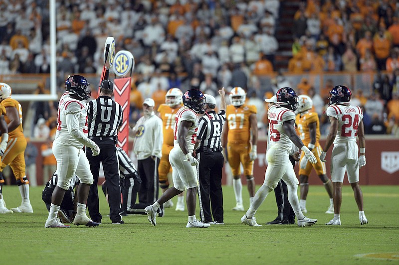 An official indicates a first down for Ole Miss after a 4th down measurement came up short for the Vols. Seconds later the situation turned bad as unhappy fans reacted. SEC football game between the University of Tennessee and Ole Miss, Saturday, October 16, 2021, at the University of Tennessee, Knoxville, Tenn. (Scott Keller/The Daily Times via AP)