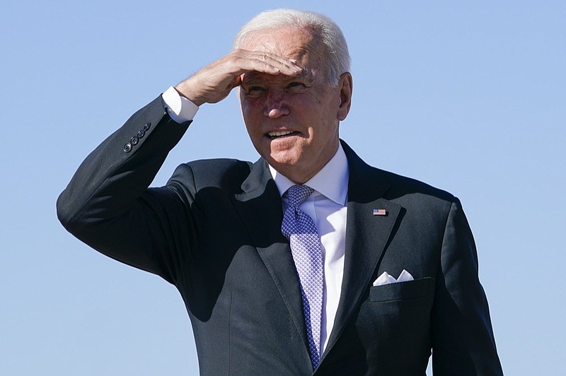 President Joe Biden shields his eyes from the sun as he walks toward Air Force One at Andrews Air Force Base, Md., Wednesday, Oct. 20, 2021. (AP Photo/Susan Walsh)


