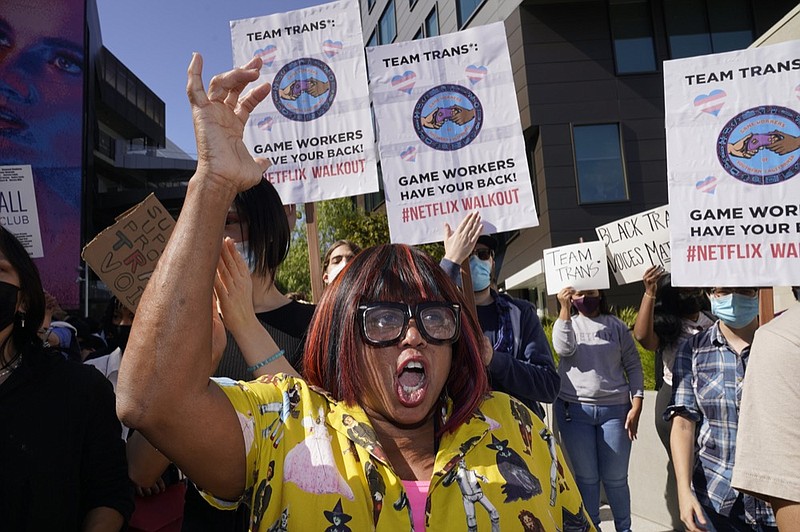 Producer Cheryl Rich joins protesters outside the Netflix building in the Hollywood section of Los Angeles, Wednesday, Oct. 20, 2021. Critics and supporters of Dave Chappelle's Netflix special and its comments about transgender people gathered outside the company's offices Wednesday. (AP Photo/Damian Dovarganes)


