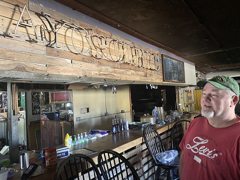 Photo by Barry Courter / Rick Mayo stands under the Mayo's Clinic (the original name) neon sign that has hung in the Brainerd restaurant almost since it opened in 1987. The bar and restaurant was closed by city in May after some structural issues were found.