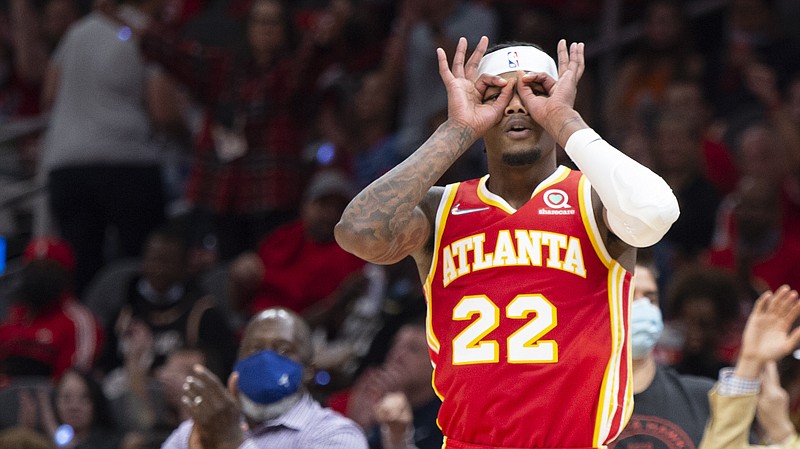 AP photo by Hakim Wright Sr. / The Atlanta Hawks' Cam Reddish celebrates after hitting a 3-pointer during the first half of the team's season-opening win against the visiting Dallas Mavericks on Thursday night.