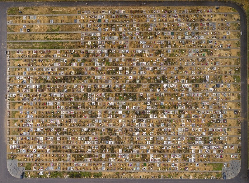 An aerial view shows fresh graves at the Yastrebkovskoe cemetery, which serves as one of the burial grounds for those who died of the coronavirus, outside in Moscow, Russia, Thursday, Oct. 21, 2021.  (AP Photo/Dmitry Serebryakov)


