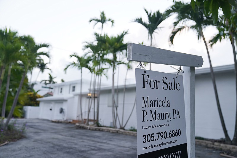 FILE - In this Thursday, Oct. 7, 2021, file photo, a waterfront home is shown for sale, in Surfside, Fla. Mortgage rates have hovered near all-time lows for much of this year, even as inflation has increased sharply across much of the economy. That could begin to change in the weeks to come, now that the Federal Reserve has signaled it could announce as early as next month plans to begin rolling back the measures it has taken to shore up the economy during the pandemic. (AP Photo/Wilfredo Lee, File)