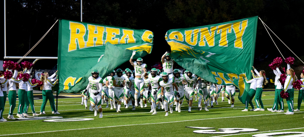 Staff Photo by Robin Rudd / The Golden Eagles break the banner as they take the field. The Bradley Central Bears hosted the Rhea County Golden Eagles in a TSSAA football game on October 22, 2021.