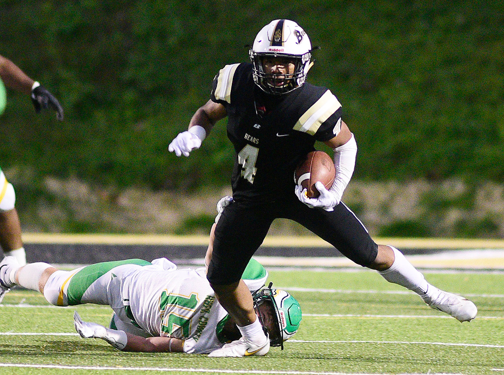 Staff Photo by Robin Rudd / Bradley's J'Alan Terry (4) breaks the tackle of Rhea's Austin Brackett (15). The Bradley Central Bears hosted the Rhea County Golden Eagles in a TSSAA football game on October 22, 2021.