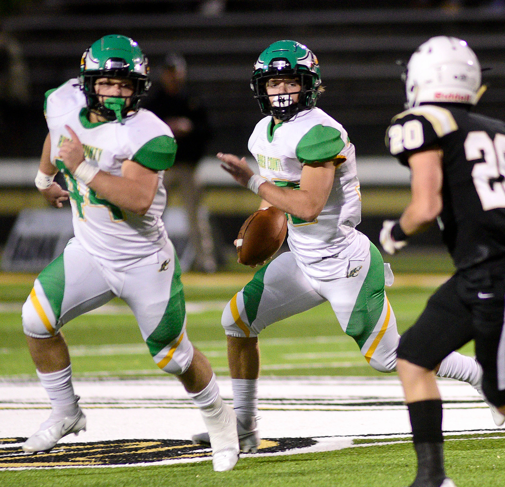 Staff Photo by Robin Rudd / Rhea's Ethan Davis (32) follows the blocking of Hunter Crowe (44). The Bradley Central Bears hosted the Rhea County Golden Eagles in a TSSAA football game on October 22, 2021.