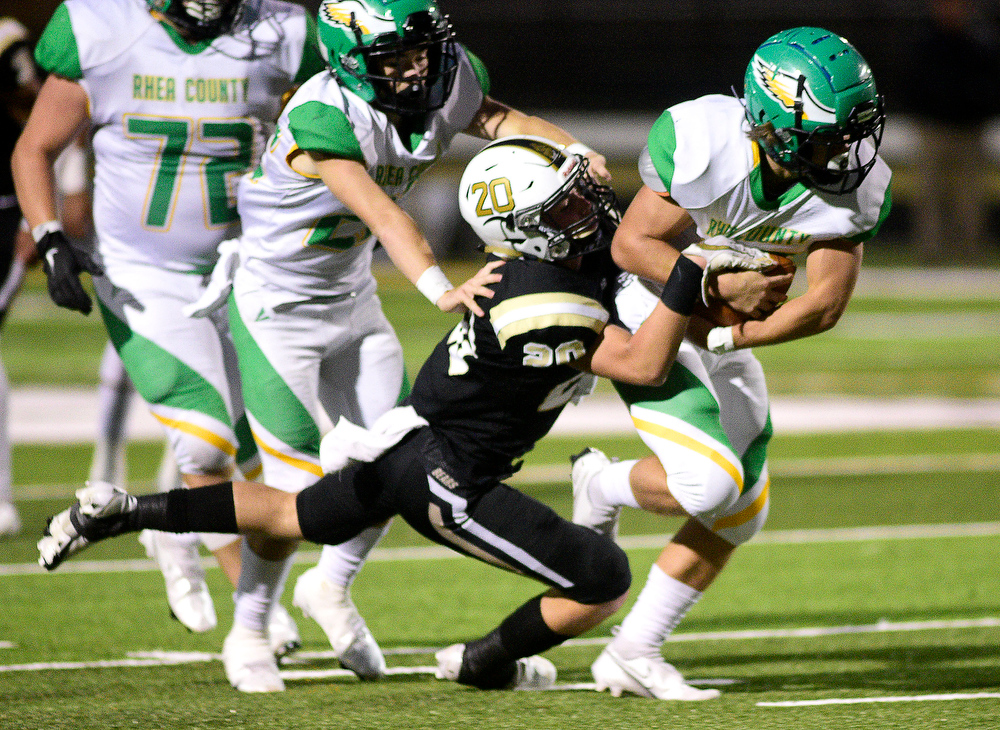 Staff Photo by Robin Rudd / Rhea's Ethan Davis (32) struggles for yardage as Bradley's Wayne Dayton (20) holds on. The Bradley Central Bears hosted the Rhea County Golden Eagles in a TSSAA football game on October 22, 2021.