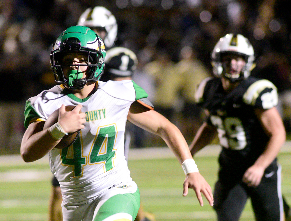 Staff photo by Robin Rudd / Rhea County's Hunter Crowe (44) runs up the middle for a touchdown Friday night at Bradley Central. The visiting Golden Eagles of Class 5A built a big lead in the first half but had to rally late for the win against Class 6A's fourth-ranked Bears.