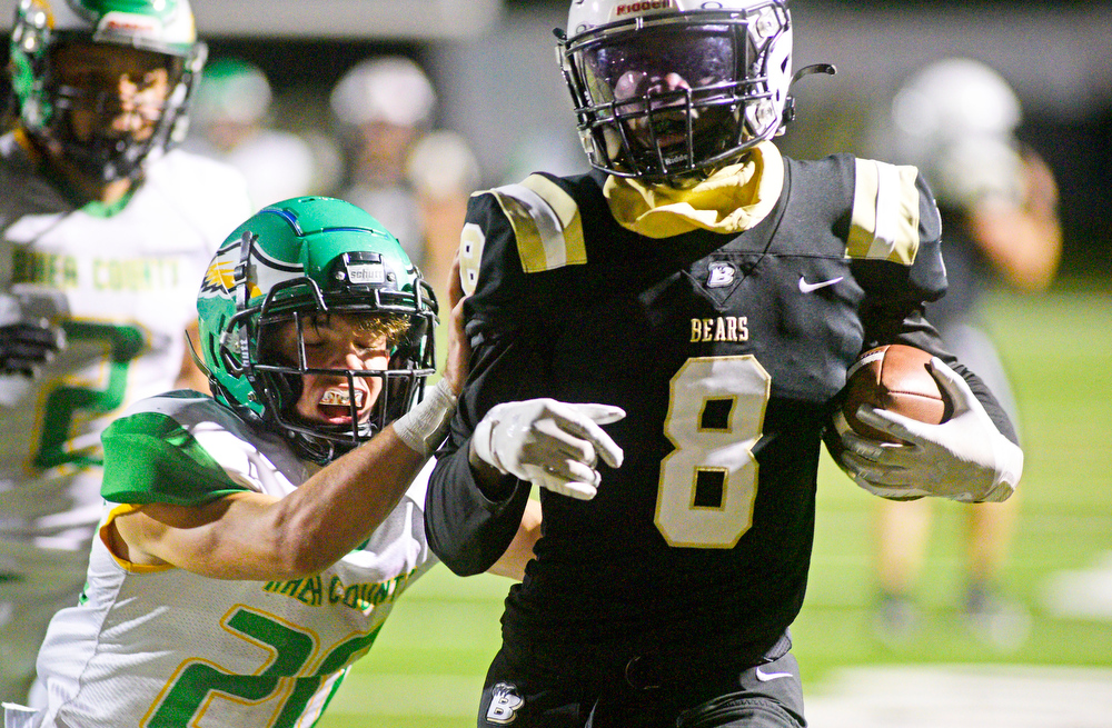 Staff Photo by Robin Rudd / Bradley's Marcus Greene Jr. (8) picks up yardage after a reception, while Rhea's Caleb O'Dell (20) defends. The Bradley Central Bears hosted the Rhea County Golden Eagles in a TSSAA football game on October 22, 2021.