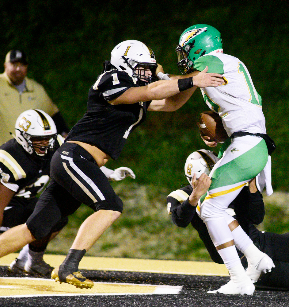 Staff Photo by Robin Rudd / Bradley's Gage Anderson (1) and Rodney Willams (6) catch Rhea quarterback Kaleb Martin (12) in the endzone for a safety. The Bradley Central Bears hosted the Rhea County Golden Eagles in a TSSAA football game on October 22, 2021.