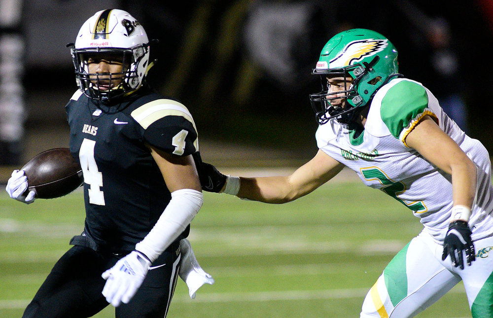 Staff Photo by Robin Rudd / Bradley's J'Alan Terry (4) gets around the corner past Rhea's Jadden Pankey (2). The Bradley Central Bears hosted the Rhea County Golden Eagles in a TSSAA football game on October 22, 2021.