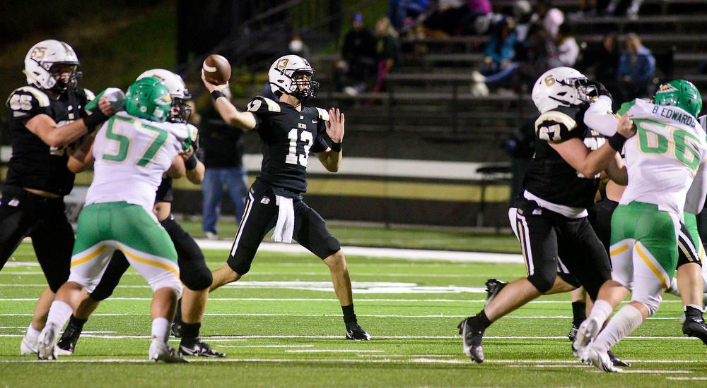 Staff Photo by Robin Rudd / Bradley quarterback Aiden McClary (13) throws for a late second quarter touchdown. The Bradley Central Bears hosted the Rhea County Golden Eagles in a TSSAA football game on October 22, 2021.