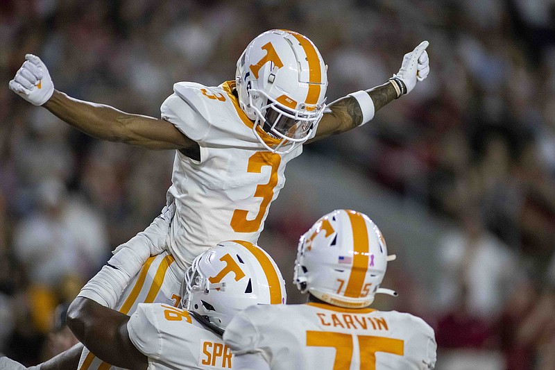 AP photo by Vasha Hunt / Tennessee wide receiver JaVonta Payton (3) celebrates with teammates after making a touchdown catch during the first half of Saturday night's game at Alabama.