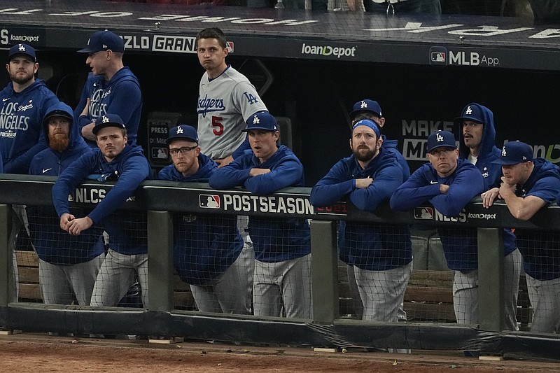 AP photo by John Bazemore / The Los Angeles Dodgers watch from their dugout during the ninth inning of Game 6 of the NL Championship Series against the host Atlanta Braves on Saturday night.