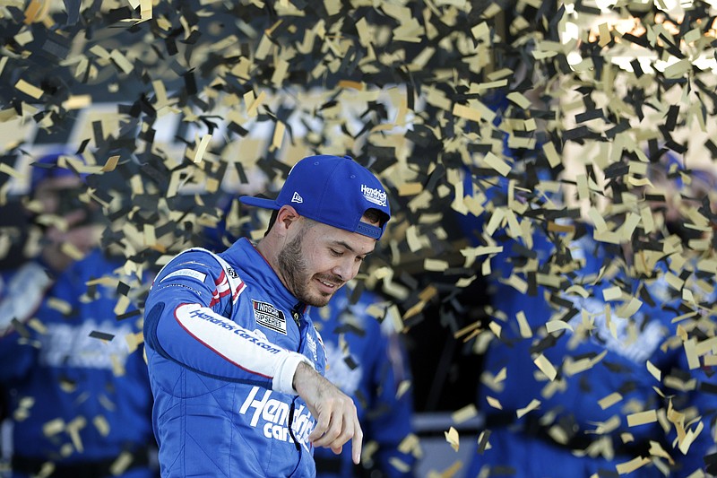 AP photo by Colin E. Braley / Hendrick Motorsports driver Kyle Larson celebrates in victory lane at Kansas Speedway after Sunday's NASCAR Cup Series playoff race.