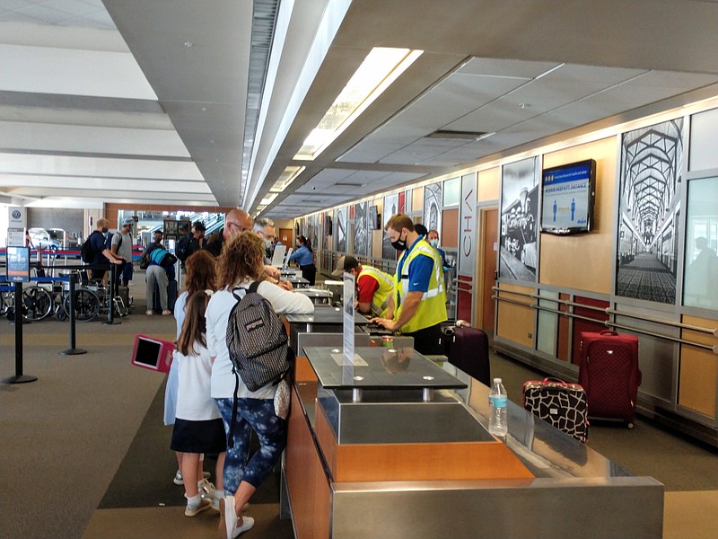 Staff photo by Mike Pare / Passengers at Chattanooga Airport check in at the ticketing counter earlier this year.