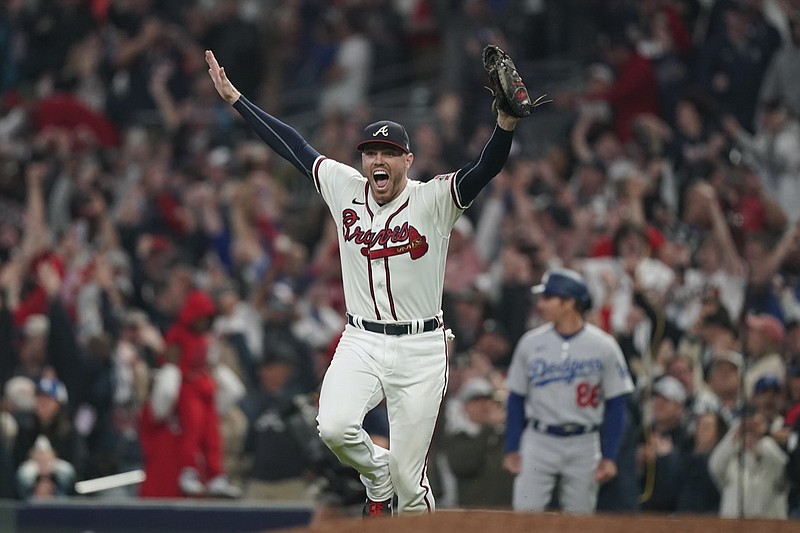 Atlanta Braves relief pitcher Will Smith celebrates after winning Game 6 of baseball's National League Championship Series against the Los Angeles Dodgers Sunday, Oct. 24, 2021, in Atlanta. The Braves defeated the Dodgers 4-2 to win the series. (AP Photo/Brynn Anderson)