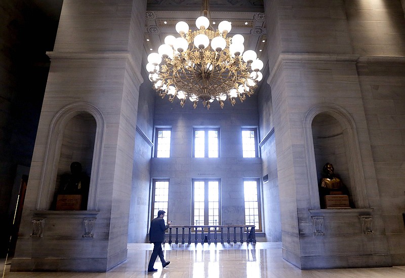 Associated Press File Photo/Mark Humphrey / A man walks through the hall outside the House and Senate chambers of the Capitol in Nashville, where today's third special session of the year will begin today.