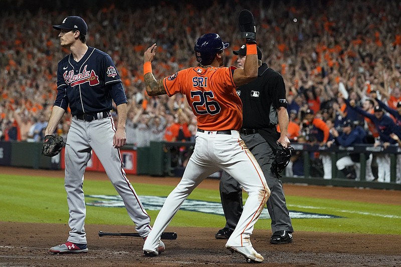 AP photo by Eric Gay / The Houston Astros' Jose Siri celebrates alongside Atlanta Braves starting pitcher Max Fried after scoring during the second inning of Game 2 of the World Series on Wednesday night.