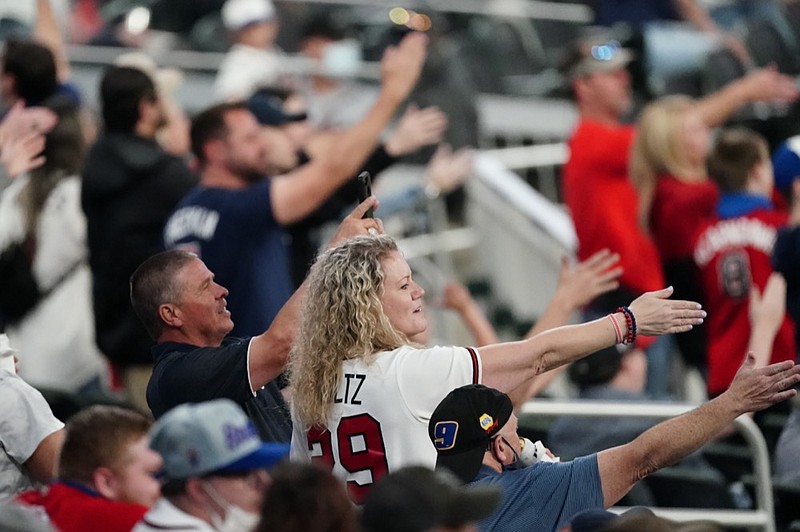 AP photo by John Bazemore / Atlanta Braves fans do the tomahawk chop during a home game against the Philadelphia Phillies on April 10.