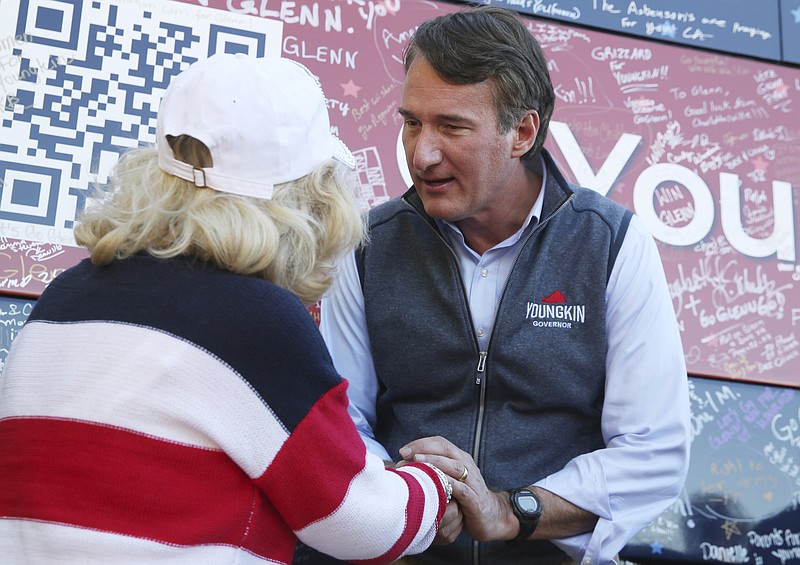 Photo by Heather Rousseau/The Roanoke Times via The Associated Press / Glenn Youngkin, Republican nominee for governor meets with supporters after a rally at the Brambleton Center in Roanoke County on Oct. 27, 2021. He talks with Evelyn Hale, 80, of Roanoke.
