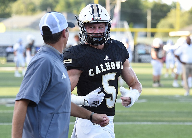 Staff photo by Matt Hamilton / Calhoun receiver Cole Speer talks to a coach before a home game against McCallie on Aug. 27. Calhoun lost to Cartersville on Friday night with the GHSA Region 7-AAAAA championship on the line.