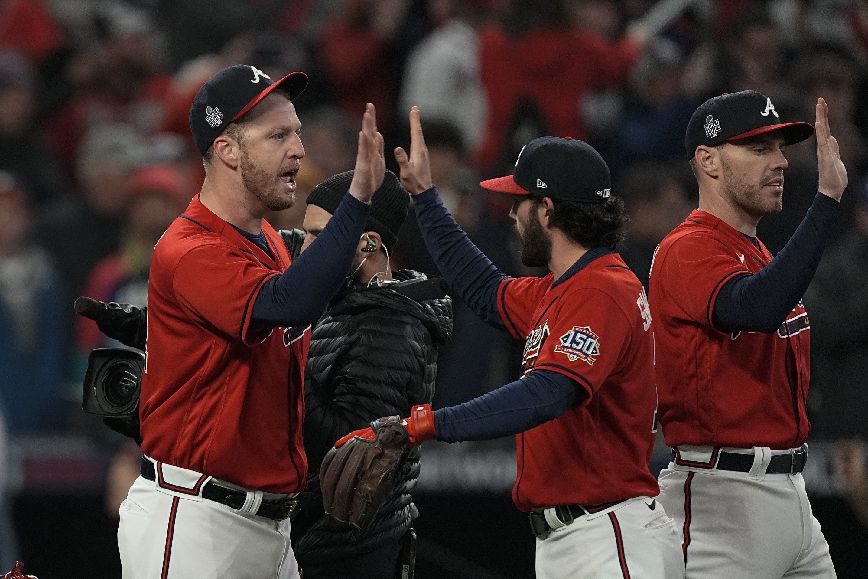 AP photo by Brynn Anderson / The Atlanta Braves celebrate their 2-0 win against the visiting Houston Astros on Friday night in Game 3 of the World Series.