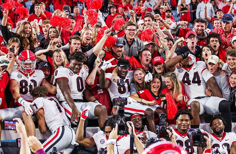 Georgia photo by Mackenzie Miles / Georgia football players celebrate with their jubilant fans after Saturday's 34-7 drubbing of Florida in Jacksonville.